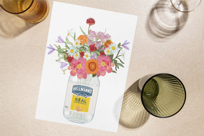 Floral arrangement in a Hellmann's mayonnaise jar on a table with glasses.