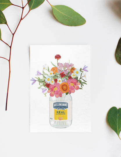 Jar with flowers in an empty Hellmann's mayonnaise jar against a white background