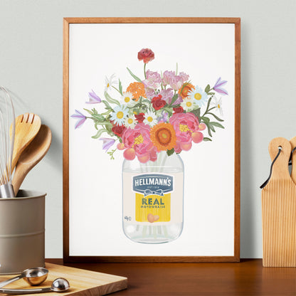 Framed artwork of a jar of Hellmann's mayonnaise with flowers on a kitchen counter.