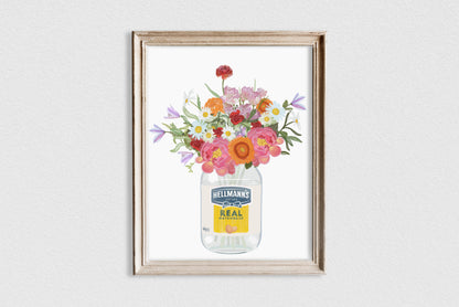 Framed artwork of a jar with flowers and Heinz logo on a white wall